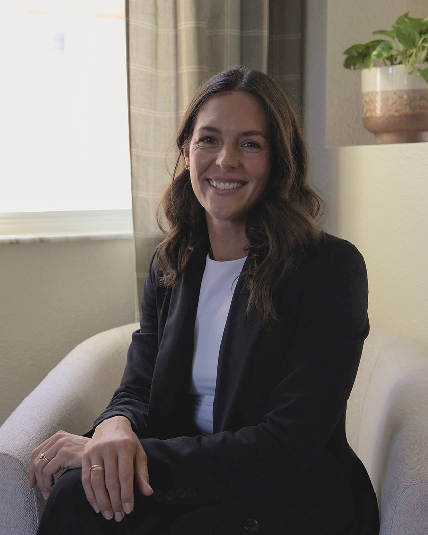 Amanda Fernandez seated in a therapy office